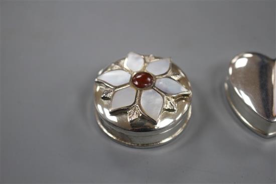 Three assorted modern silver pill boxes, including oval with hardstone lid, heart shaped and circular with shell inset lid, largest 4cm